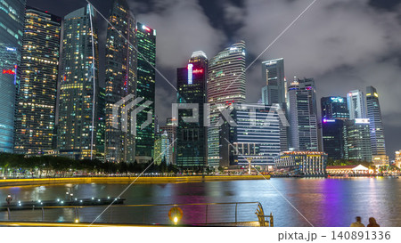 Business Financial Downtown City and Skyscrapers Tower Building at Marina Bay night timelapse hyperlapse, Singapore Business Financial Downtown City and Skyscrapers Tower Building at Marina Bay night timelapse hyperlapse, Singapore 140891336