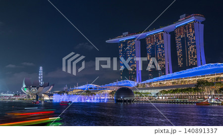 Beautiful laser and musical fountain show at the Marina Bay Sands waterfront in Singapore night timelapse Beautiful laser and musical fountain show at the Marina Bay Sands waterfront in Singapore night timelapse 140891337