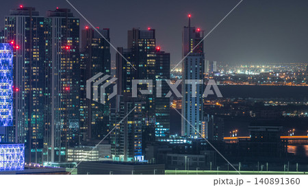 Aerial skyline of Abu Dhabi city centre from above night timelapse Aerial skyline of Abu Dhabi city centre from above night timelapse 140891360
