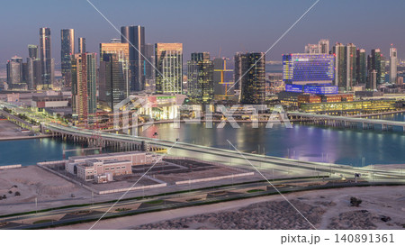 Aerial skyline of Abu Dhabi city centre from above day to night timelapse Aerial skyline of Abu Dhabi city centre from above day to night timelapse 140891361