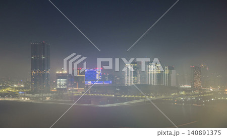 Buildings on Al Reem island in Abu Dhabi night timelapse from above. Buildings on Al Reem island in Abu Dhabi night timelapse from above. 140891375