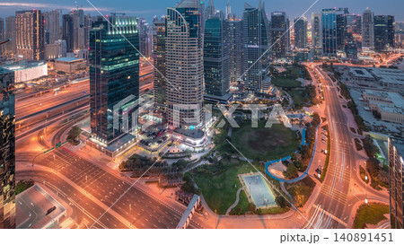 Jumeirah Lake Towers residential district aerial day to night timelapse near Dubai Marina 140891451