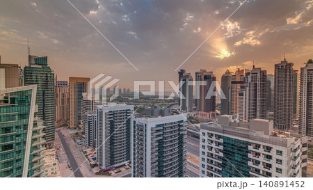 Sunrise view of various skyscrapers and towers in Dubai Marina from above aerial timelapse Sunrise view of various skyscrapers and towers in Dubai Marina from above aerial timelapse 140891452