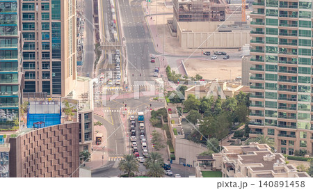 Aerial view of a road intersection in a big city timelapse. Aerial view of a road intersection in a big city timelapse. 140891458