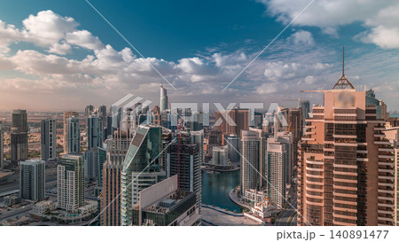 Dubai Marina skyscrapers and jumeirah lake towers view from the top aerial timelapse in the United Arab Emirates. Dubai Marina skyscrapers and jumeirah lake towers view from the top aerial timelapse in the United Arab Emirates. 140891477