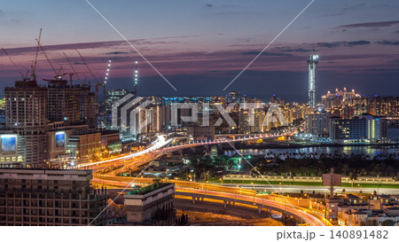 Palm Jumeirah Highway bridge aerial day to night timelapse. Dubai, United Arab Emirates Palm Jumeirah Highway bridge aerial day to night timelapse. Dubai, United Arab Emirates 140891482