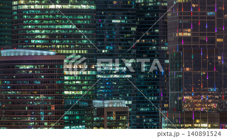 Modern office building with glowing windows at night timelapse. Moscow city Modern office building with glowing windows at night timelapse. Moscow city 140891524