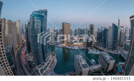 Evening illumination of Dubai Marina day to night aerial timelapse, UAE. Evening illumination of Dubai Marina day to night aerial timelapse, UAE. 140891555