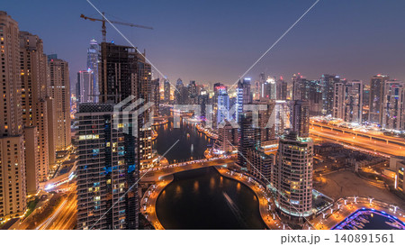 Beautiful aerial top view day to night transition timelapse of Dubai Marina canal Beautiful aerial top view day to night transition timelapse of Dubai Marina canal 140891561