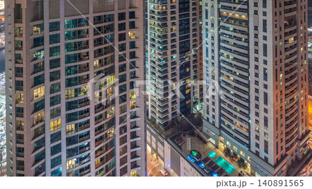 Scenic glowing windows of skyscrapers at night timelapse 140891565