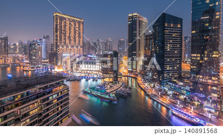 Beautiful aerial top view day to night transition timelapse of Dubai Marina canal 140891568