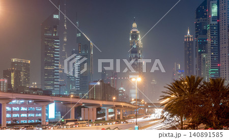 Traffic on intersection and bridge at the Sheikh Zayed Road day to night timelapse Traffic on intersection and bridge at the Sheikh Zayed Road day to night timelapse 140891585