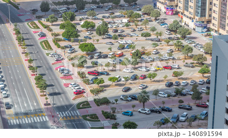 Top view of parking lot timelapse from rooftop of skyscraper 140891594