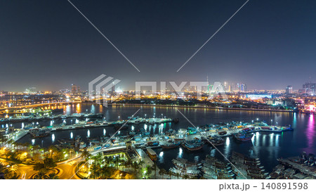 Dubai creek landscape day to night timelapse with boats and ship near waterfront Dubai creek landscape day to night timelapse with boats and ship near waterfront 140891598