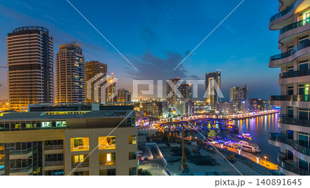 An Aerial view of Dubai Marina towers in Dubai day to night timelapse An Aerial view of Dubai Marina towers in Dubai day to night timelapse 140891645