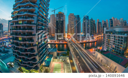 An Aerial view of Dubai Marina towers in Dubai day to night timelapse An Aerial view of Dubai Marina towers in Dubai day to night timelapse 140891646