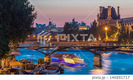 View to Pont des Arts in Paris after sunset day to night timelapse, France View to Pont des Arts in Paris after sunset day to night timelapse, France 140891717
