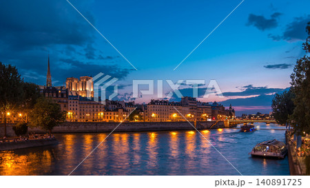Le Pont D'Arcole bridge after sunset with people and boats day to night timelapse, Paris, France, Europe Le Pont D'Arcole bridge after sunset with people and boats day to night timelapse, Paris, France, Europe 140891725