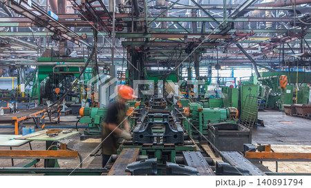 Conveyor assembly stage the body of tractor at big industrial factory timelapse Conveyor assembly stage the body of tractor at big industrial factory timelapse 140891794