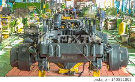 Conveyor assembly stage the body of tractor at big industrial factory timelapse 140891802