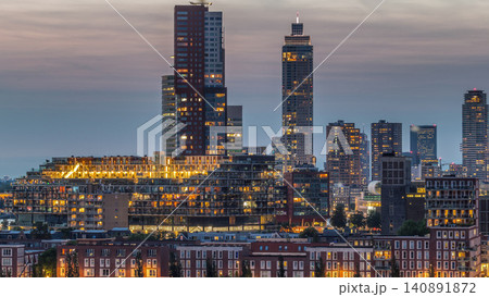 Aerial day to night timelapse of Katendrecht peninsula and Maashaven harbour in Rotterdam, The Netherlands. Aerial day to night timelapse of Katendrecht peninsula and Maashaven harbour in Rotterdam, The Netherlands. 140891872