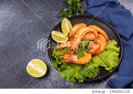 Fresh cooked prawns on lettuce with lime Fresh cooked prawns on lettuce with lime 140892126