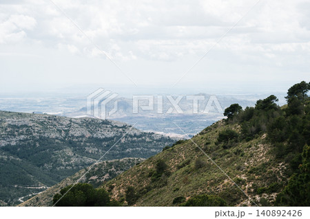 Scenic mountain landscape with cloudy sky and distant horizon Scenic mountain landscape with cloudy sky and distant horizon 140892426