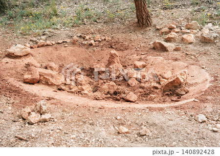 Natural earth circle with rocks in forested area under tree Natural earth circle with rocks in forested area under tree 140892428