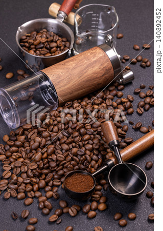 Coffee beans, grinder and ground coffee creating aromatic composition 140892452