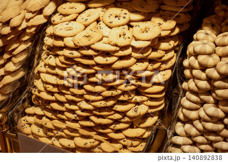 Delicious pile of assorted cookies displayed in a bakery setting Delicious pile of assorted cookies displayed in a bakery setting 140892838