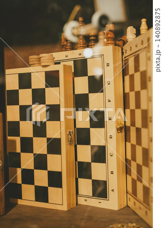Elegant wooden chessboard display with unique lettering and intricate details Elegant wooden chessboard display with unique lettering and intricate details 140892875