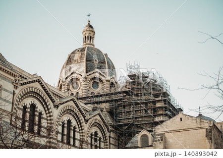 Historic cathedral dome under restoration with scaffolding enhancing architectural details Historic cathedral dome under restoration with scaffolding enhancing architectural details 140893042