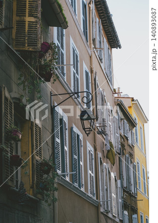 Charming european architecture with colorful shuttered windows and balconies 140893087