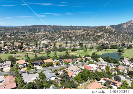 Aerial view of Ramona neighborhood with mountain, valley and golf course Aerial view of Ramona neighborhood with mountain, valley and golf course 140893342