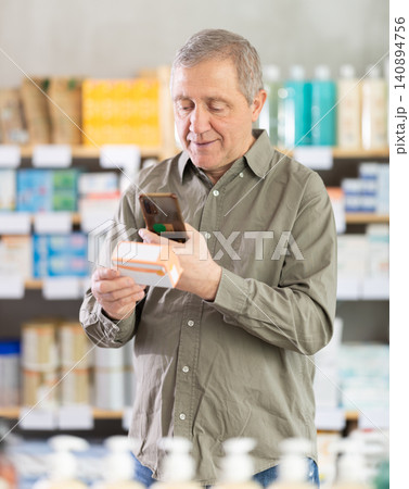Man scans for mobile paracetamol Man scans for mobile paracetamol 140894756