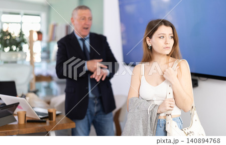 head of a successful company, got angry and scolds at a young employee for being late 140894768