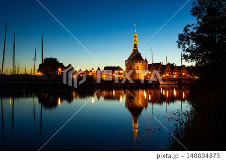 Harbour of Hoorn with sailboats at evening and the Hoofdtoren. Hoorn is harbor town at the Markermeer dating back to the 12th century, Hoorn, Netherlands 140894875