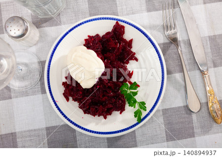 Salad of grated baked beetroot with sour cream and fresh parsley Salad of grated baked beetroot with sour cream and fresh parsley 140894937