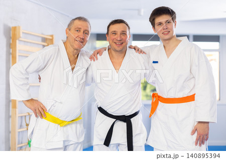 Group of male karatekas posing in studio Group of male karatekas posing in studio 140895394