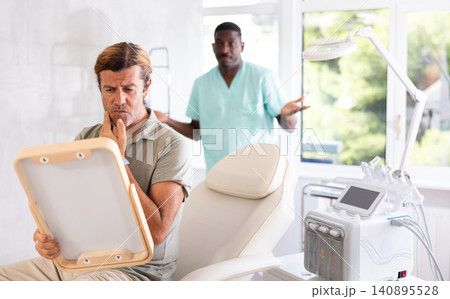 cosmetic physician confidently presents patient cosmetic physician confidently presents patient 140895528
