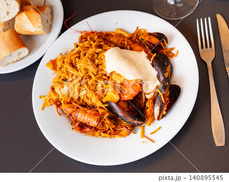 Pasta with seafood contains tiger prawns, shell mussels, spices and white sauce Pasta with seafood contains tiger prawns, shell mussels, spices and white sauce 140895545