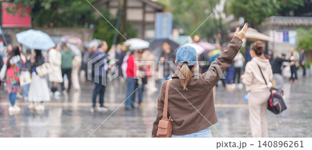 Happy woman traveler travel in Chengdu city. Tourist sightseeing and shopping in Kuan Zhai Alley or wide and narrow alleys, Famous Landmark for tourism attraction in Sichuan, China Happy woman traveler travel in Chengdu city. Tourist sightseeing and shopping in Kuan Zhai Alley or wide and narrow alleys, Famous Landmark for tourism attraction in Sichuan, China 140896261