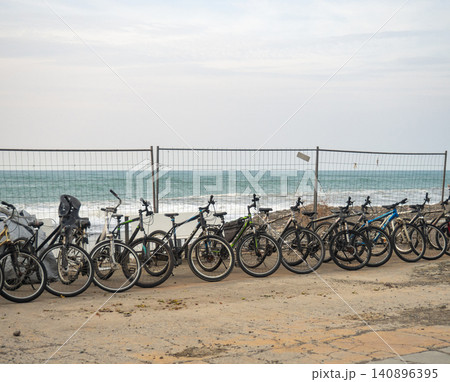 Bicycles for rent are located along the sea. Transport rental at the resort. Business on the beach. not a season . 140896395