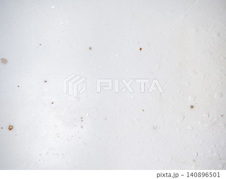 Mold on the enamel in the bathroom. Mold spores in the bathroom. Black dots on a white background. The problem of everyday life. The need for a cleaning product Mold on the enamel in the bathroom. Mold spores in the bathroom. Black dots on a white background. The problem of everyday life. The need for a cleaning product 140896501