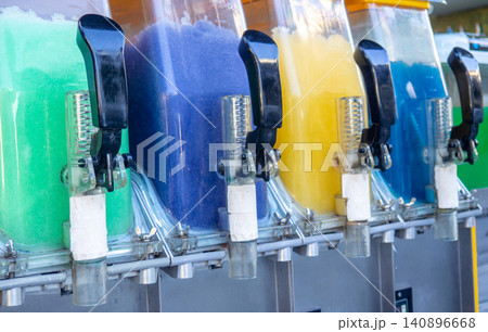 Vending machine with soft drinks and ice. Levers of a water machine Vending machine with soft drinks and ice. Levers of a water machine 140896668