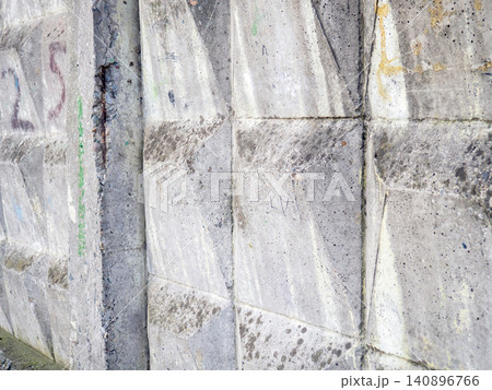 Concrete wall background. Pattern on a concrete fence. Industrial zone. Gray stone background. Concrete wall background. Pattern on a concrete fence. Industrial zone. Gray stone background. 140896766