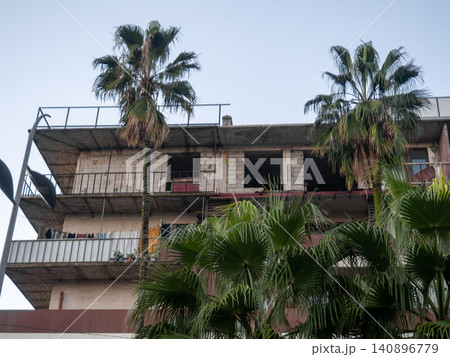 Housing on several floors in a southern city. Houses for rent in the resort. Autumn in the south. Housing on several floors in a southern city. Houses for rent in the resort. Autumn in the south. 140896779
