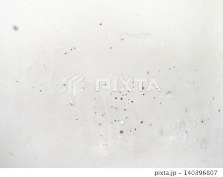 Mold on the surface of the bath. Dark mold close-up on bath enamel. Dirty white surface. Mold on the surface of the bath. Dark mold close-up on bath enamel. Dirty white surface. 140896807