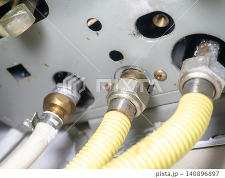 Part of gas equipment. Hoses in a gas water heater. Gas flows through these pipes at home. Part of gas equipment. Hoses in a gas water heater. Gas flows through these pipes at home. 140896897