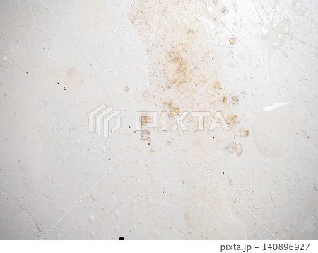 Mold on bathroom enamel. Mold spores in the bathroom. Black dots on a white background. A problem for everyday life. The need for a cleaning agent. Mold on bathroom enamel. Mold spores in the bathroom. Black dots on a white background. A problem for everyday life. The need for a cleaning agent. 140896927